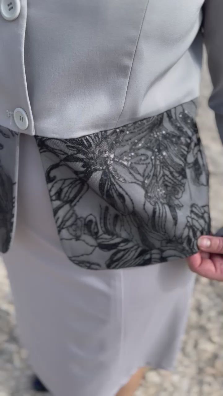 Close up on details on light grey and black dog show suit. Sapphire by Canis Certo.