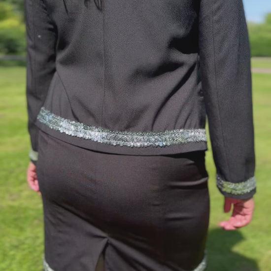 Dog handler wearing a black dog show suit with sequin details in stretchy material. Celestite by Canis Certo.