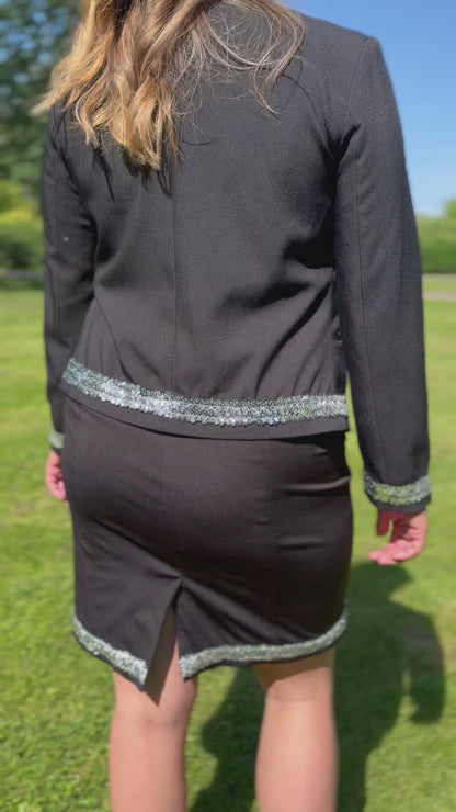 Dog handler wearing a black dog show suit with sequin details in stretchy material. Celestite by Canis Certo.