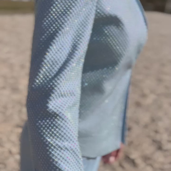 Video of female dog handler wearing a light blue, sparkly dog show handler suit. Diamond by Canis Certo.