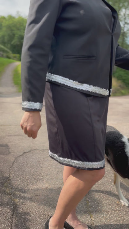 Dog handler wearing a black dog show suit with sequin details in stretchy material. Celestite by Canis Certo.